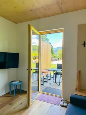 a room with a sliding glass door leading to a patio at Apartment Kovacic - Lake Bled in Bled