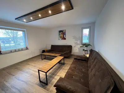 a living room with a couch and a table at Apartma - Hiša Zofija in Slovenske Konjice