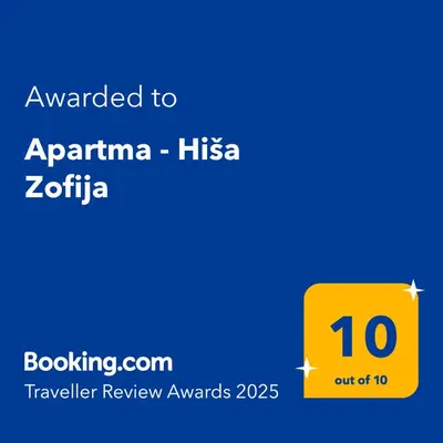 a yellow box with the text awarded to aparna hsiczazazaza at Apartma - Hiša Zofija in Slovenske Konjice