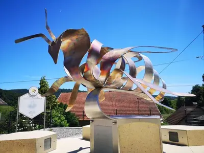 a statue of a statue of a large insect at Cozzy cottage near Ljubljana in Višnja Gora