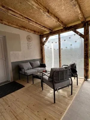 a living room with a couch and a table at Apartma in Wellness Sladka Gora in Šmarje pri Jelšah