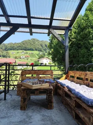 a patio with a table with a chessboard on it at Apartma in Wellness Sladka Gora in Šmarje pri Jelšah