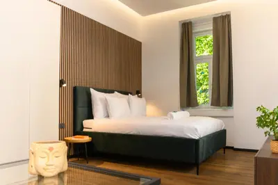 a hotel room with a bed and a window at Villa Avrelia in Ljubljana
