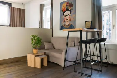 a living room with a couch and a table at Villa Avrelia in Ljubljana