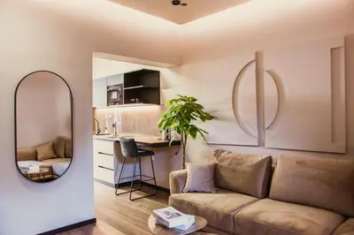 a living room with a couch and a table at Villa Avrelia in Ljubljana