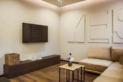 a living room with a couch and a tv at Villa Avrelia in Ljubljana