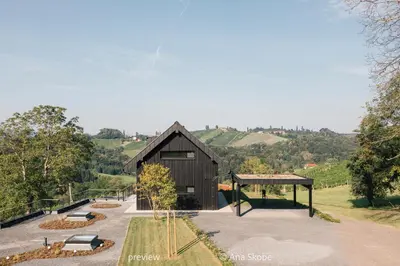 a building with a pavilion in the middle of a park at Vila Slatina Weinderer in Svečina