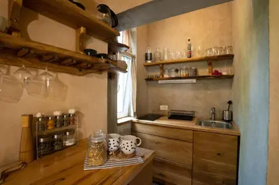 a kitchen with a sink and a counter with mugs at Alpine styled apartment in central BLED in Bled
