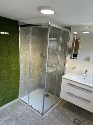 a bathroom with a shower and a sink at Suite Appartments Gregorčičeva in Ljubljana