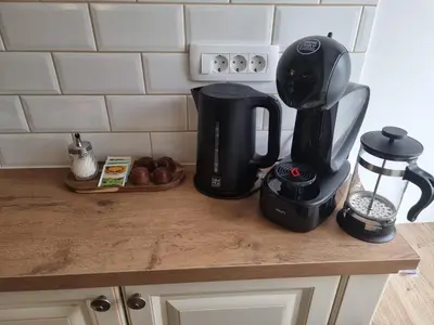 a counter with a coffee maker and a coffeemaker at Apartment HANI in Kranjska Gora