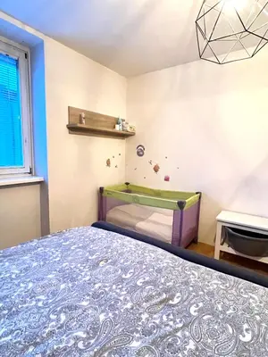 a bedroom with a bed and a trampoline at Pero cozy apartment in Ljubljana
