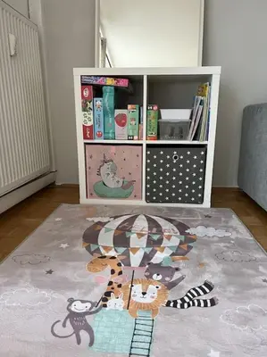 a book shelf filled with books in a room at Pero cozy apartment in Ljubljana