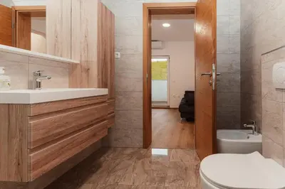 a bathroom with a toilet and a sink at Apartmaji Laznik in Ljubno