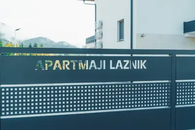 a sign for a parramatta laganksky kk on a fence at Apartmaji Laznik in Ljubno