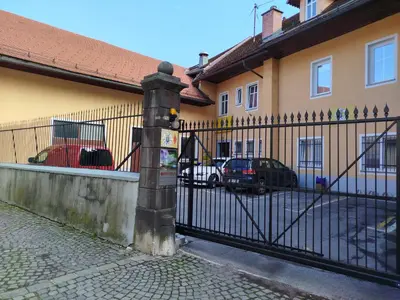 a wrought iron fence in front of a building at Apartma Mamut 1850 in Kamnik