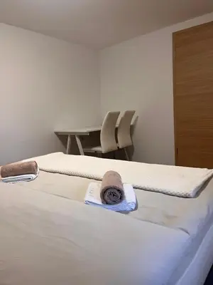 a hotel room with a bed with towels on it at Pr Šemnič in Kamnik