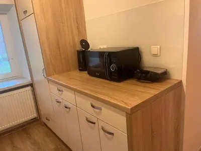 a microwave sitting on a counter in a room at Pr Šemnič in Kamnik