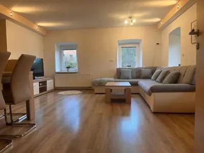 a living room with a couch and a tv at Pr Šemnič in Kamnik