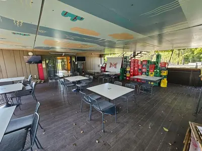 a dining room with tables and chairs in a restaurant at L&A Mobile House in Metlika
