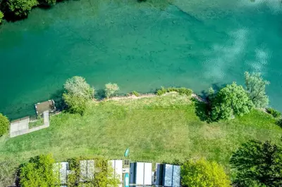 an aerial view of an island in the water at L&A Mobile House in Metlika