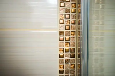 a wall full of votives in a refrigerator at Rooms Ambrožič in Bled