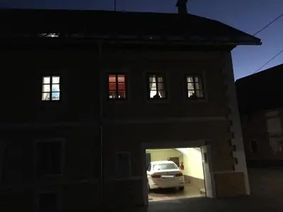 a car parked in the garage of a building at night at Apartment Bohinjčan in Bohinj