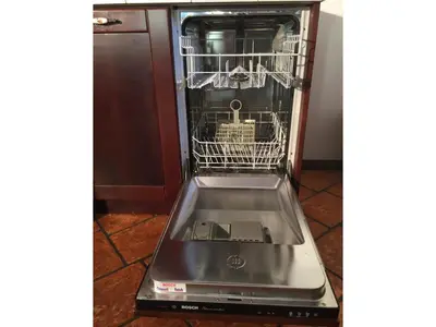 a dishwasher with its door open in a kitchen at Apartment Bohinjčan in Bohinj