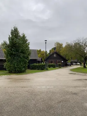 a parking lot in front of a house at Hiška Nisa in Čatež ob Savi