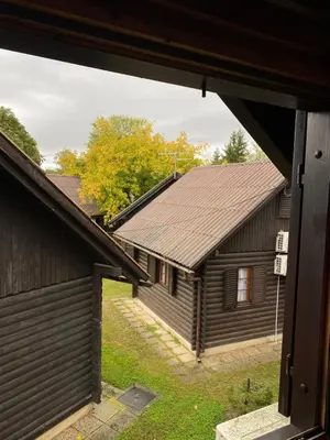 a view of two buildings from a window at Hiška Nisa in Čatež ob Savi