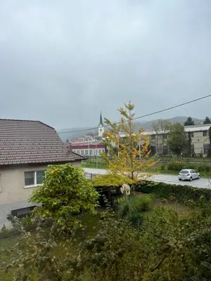 a car driving down a street in a city at Prenočišče Buco in Krško