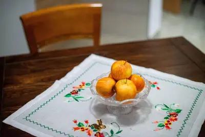 a bowl of fruit sitting on a table at Apartma Sejalec, Lesce - Bled in Lesce