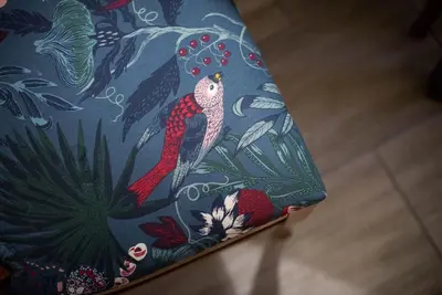 a chair with a peacock design on it at Apartma Sejalec, Lesce - Bled in Lesce