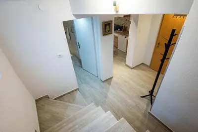 a view of a hallway with a stairway in a house at Apartma Sejalec, Lesce - Bled in Lesce