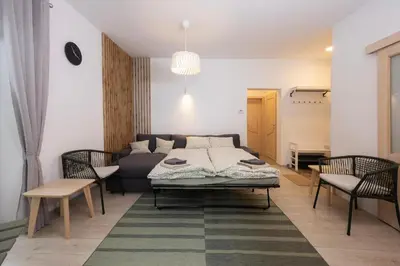 a living room with a couch and a table at Apartma Medved - Pokljuka in Zgornje Gorje