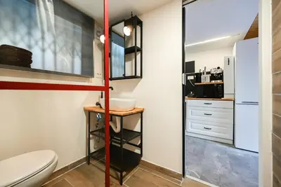a bathroom with a toilet and a sink at Apartma N'Poznam župa in Ljubljana