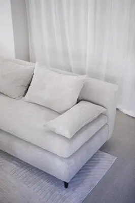 a white couch with pillows on it in a room at Apartment Sturje in Ajdovščina
