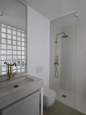 a bathroom with a sink and a toilet and a shower at Apartment Sturje in Ajdovščina