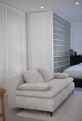 a living room with a couch and a bed at Apartment Sturje in Ajdovščina