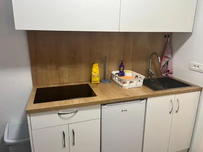 a kitchen with a sink and a counter top at Apartment Adam & Eva, Near terme Olimia, Free Parking in Podčetrtek