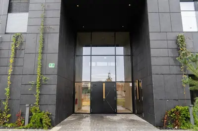 an entrance to a building with a revolving door at Ella's Cozy place in Ljubljana