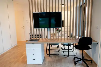 a desk with a television on top of it at Ella's Cozy place in Ljubljana