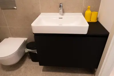 a bathroom with a sink and a toilet at Ella's Cozy place in Ljubljana
