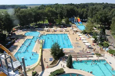 an overhead view of a large pool with people in it at Apartmaji Irma in Moravske Toplice