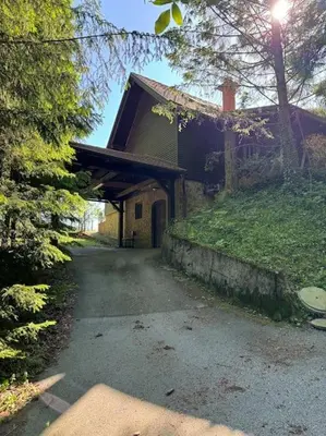 a house with a walkway leading into a driveway at Chalet Neva in Loče pri Poljčanah