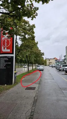 a red hose on the side of a street at Industrial vibe flat in Ljubljana