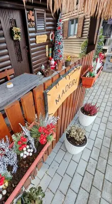a sign for a market with potted plants at Madeira House - Terme Čatež in Čatež ob Savi