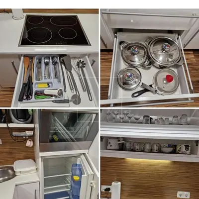 a kitchen with a stove and some utensils at Madeira House - Terme Čatež in Čatež ob Savi