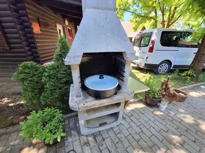 a stone oven with a toilet in a yard at Madeira House - Terme Čatež in Čatež ob Savi