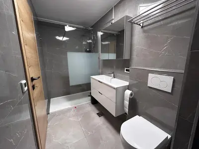 a bathroom with a toilet and a sink and a shower at Apartment Angelina in Cerklje na Gorenjskem
