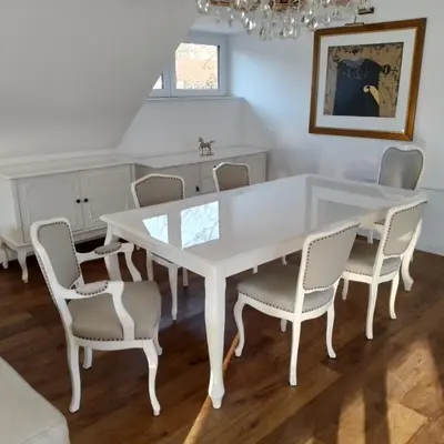 a white table and chairs in a dining room at Delux apartment at Robida Estate in Dolenjske Toplice